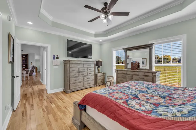 a bedroom with a bed and a flat screen television