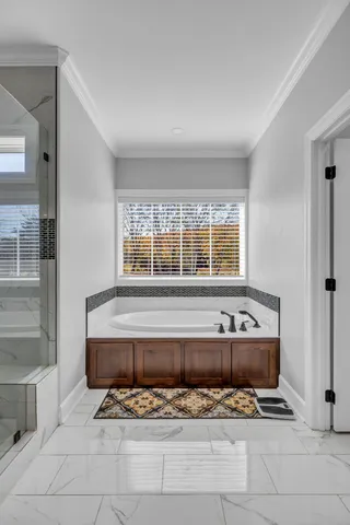 a living room with a window and a sink