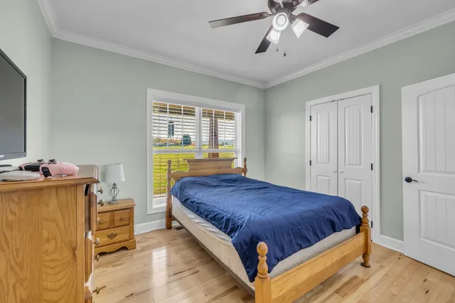 a bedroom with a bed and window