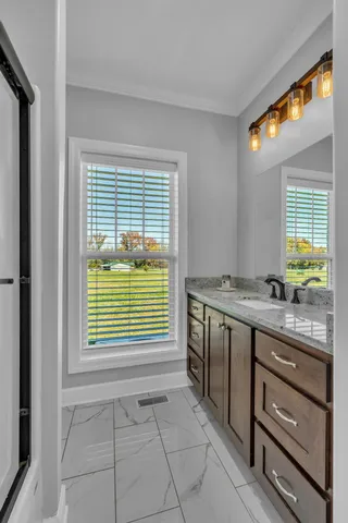 a view of a kitchen and an empty room