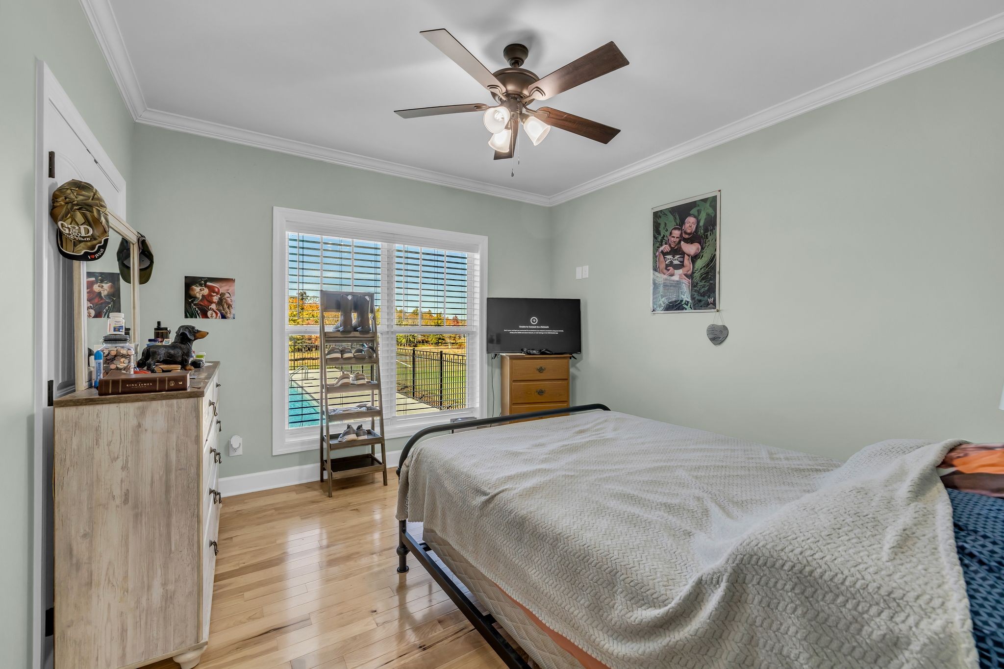 1645 Oak Grove Road Decherd, TN 37324 - Photo 22 of 46 a bedroom with a bed and dresser with wooden floor