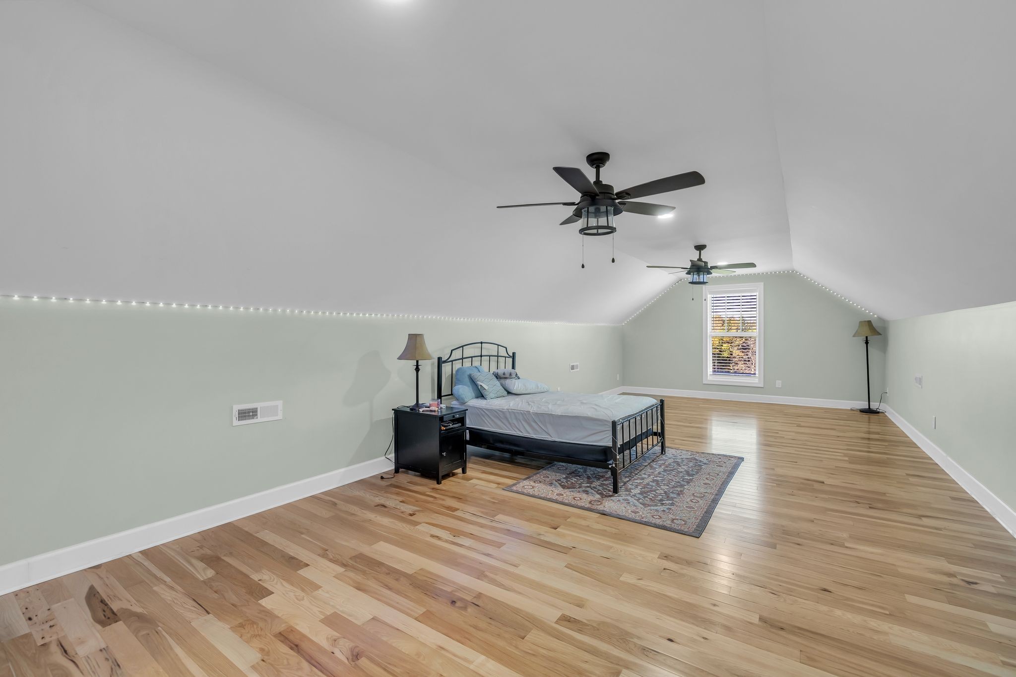 1645 Oak Grove Road Decherd, TN 37324 - Photo 26 of 46 a bedroom with a bed and a ceiling fan