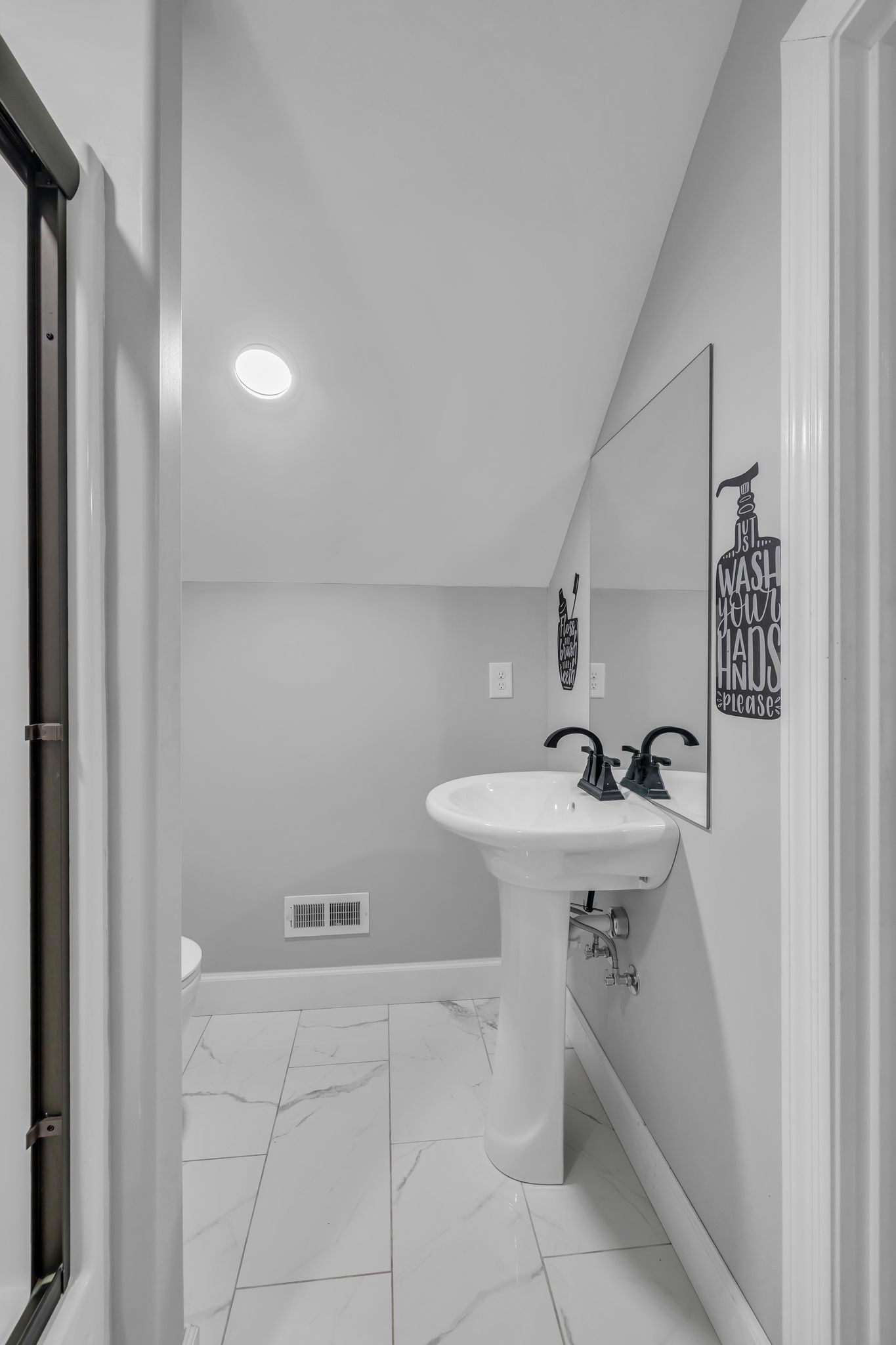 1645 Oak Grove Road Decherd, TN 37324 - Photo 28 of 46 a bathroom with a sink and mirror