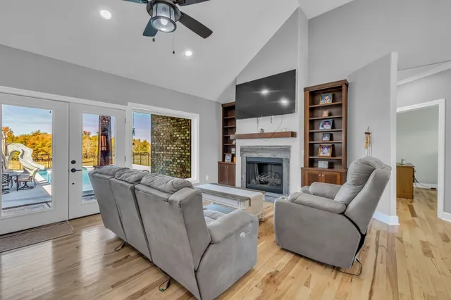 a living room with furniture and a fireplace