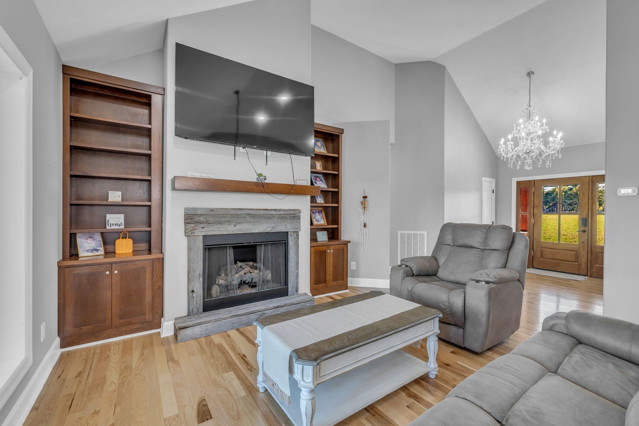1645 Oak Grove Road Decherd, TN 37324 - Photo 9 of 46 a living room with furniture and a fireplace
