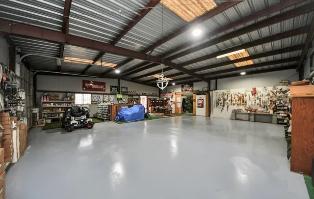 a view of a house with backyard and lake view