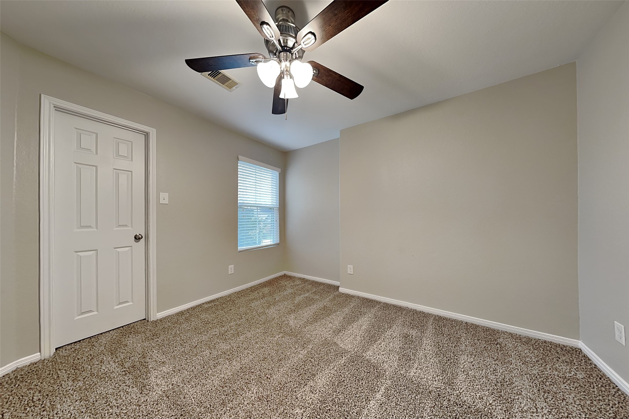 2519 Elm Crossing Trail Spring, TX 77386 - Photo 12 of 20 an empty room with windows and fan