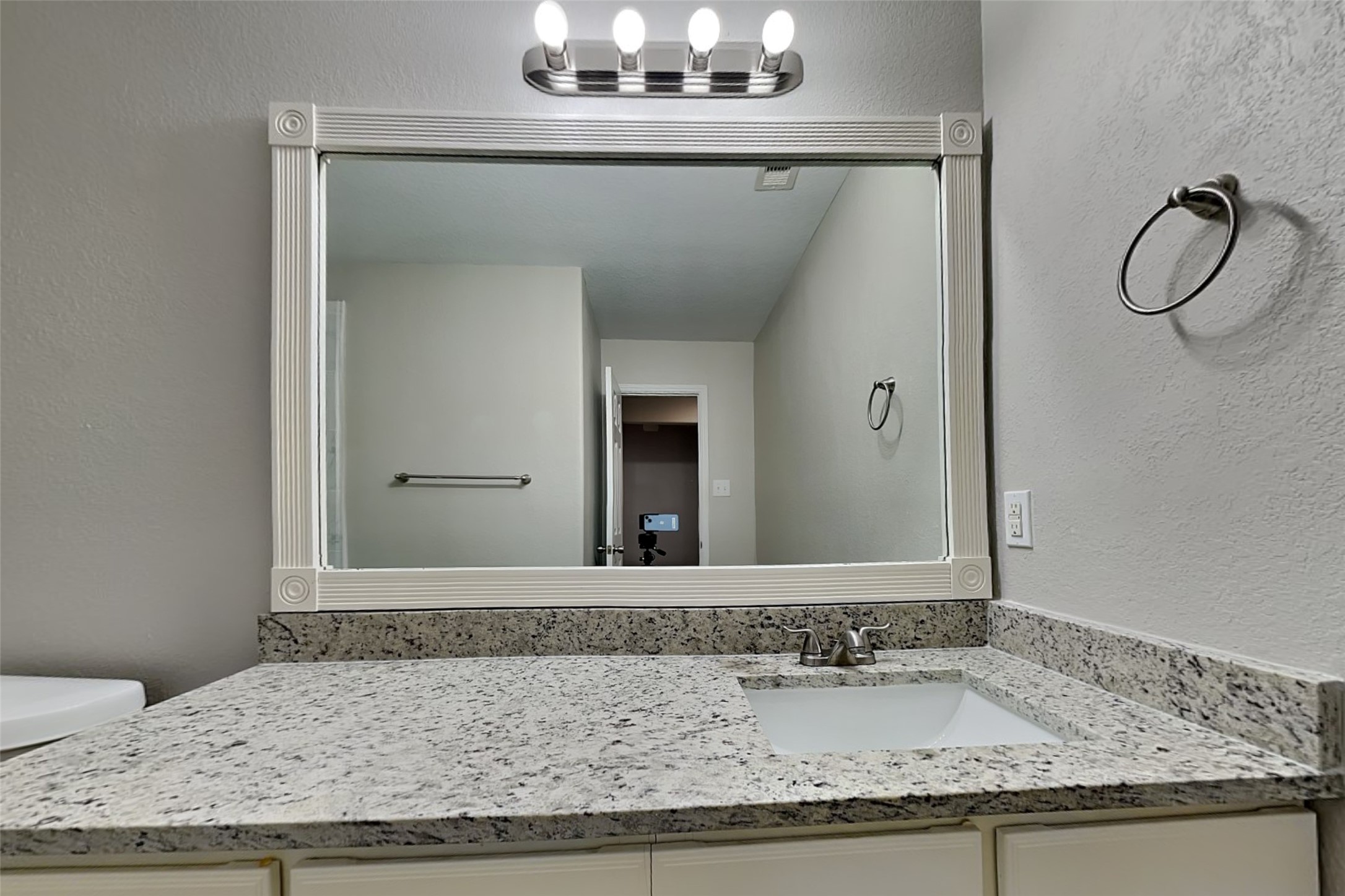 2519 Elm Crossing Trail Spring, TX 77386 - Photo 16 of 20 a bathroom with a granite countertop sink and a mirror