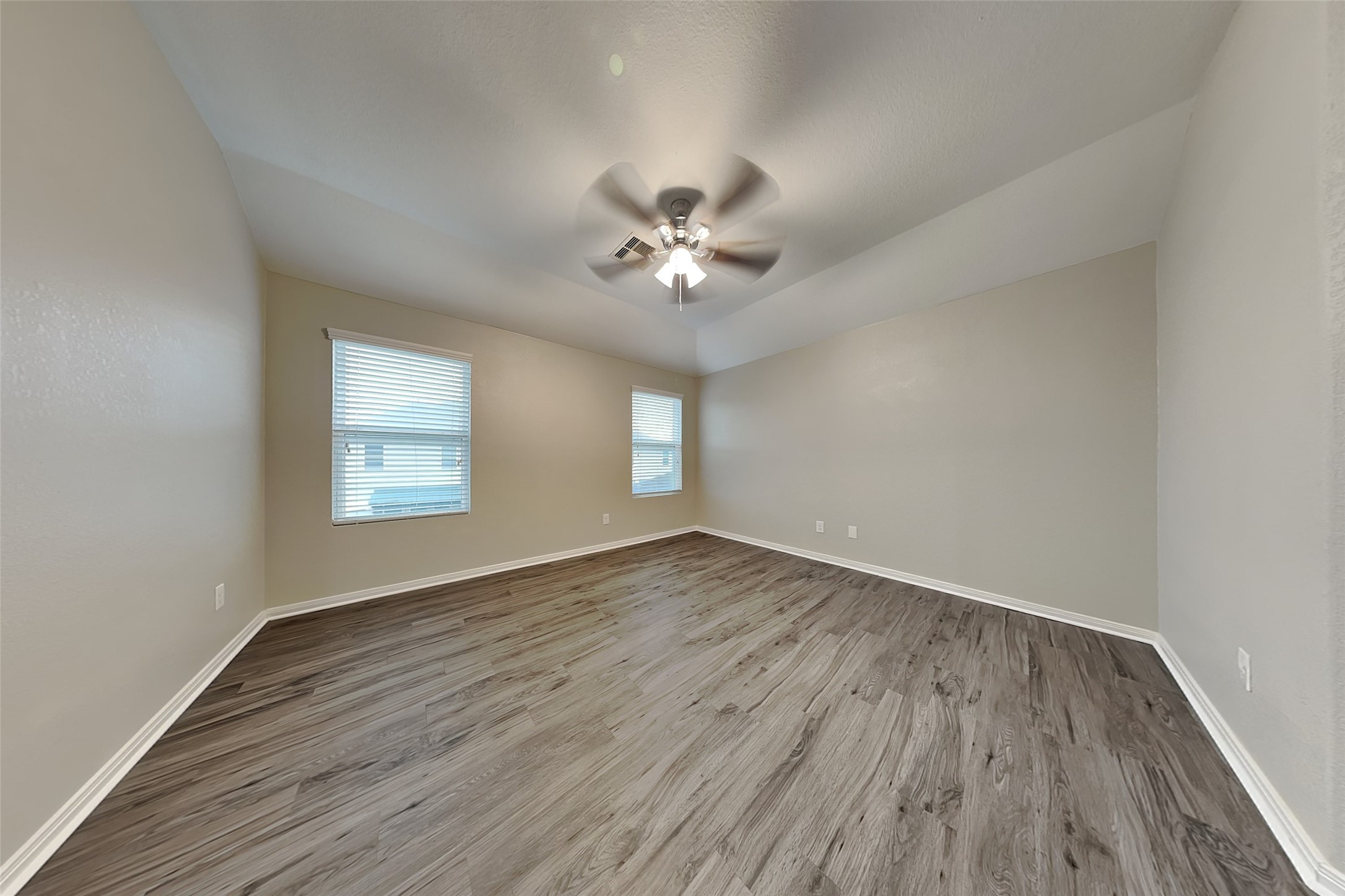 2519 Elm Crossing Trail Spring, TX 77386 - Photo 5 of 20 an empty room with wooden floor and windows