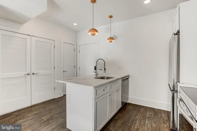 a bathroom with a sink a mirror and shower