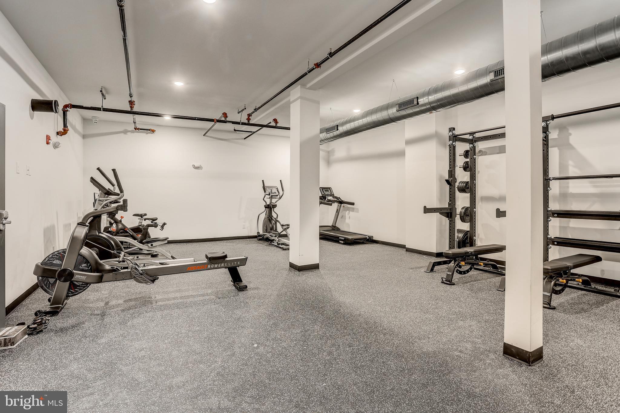 5959-63 Ridge Avenue, Unit 1BED/1BATH Philadelphia, PA 19128 - Photo 2 of 32 a view of a room with gym equipment