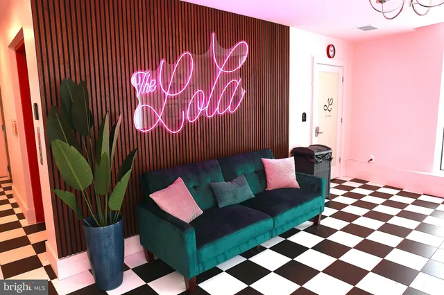 a living room with furniture and a rug