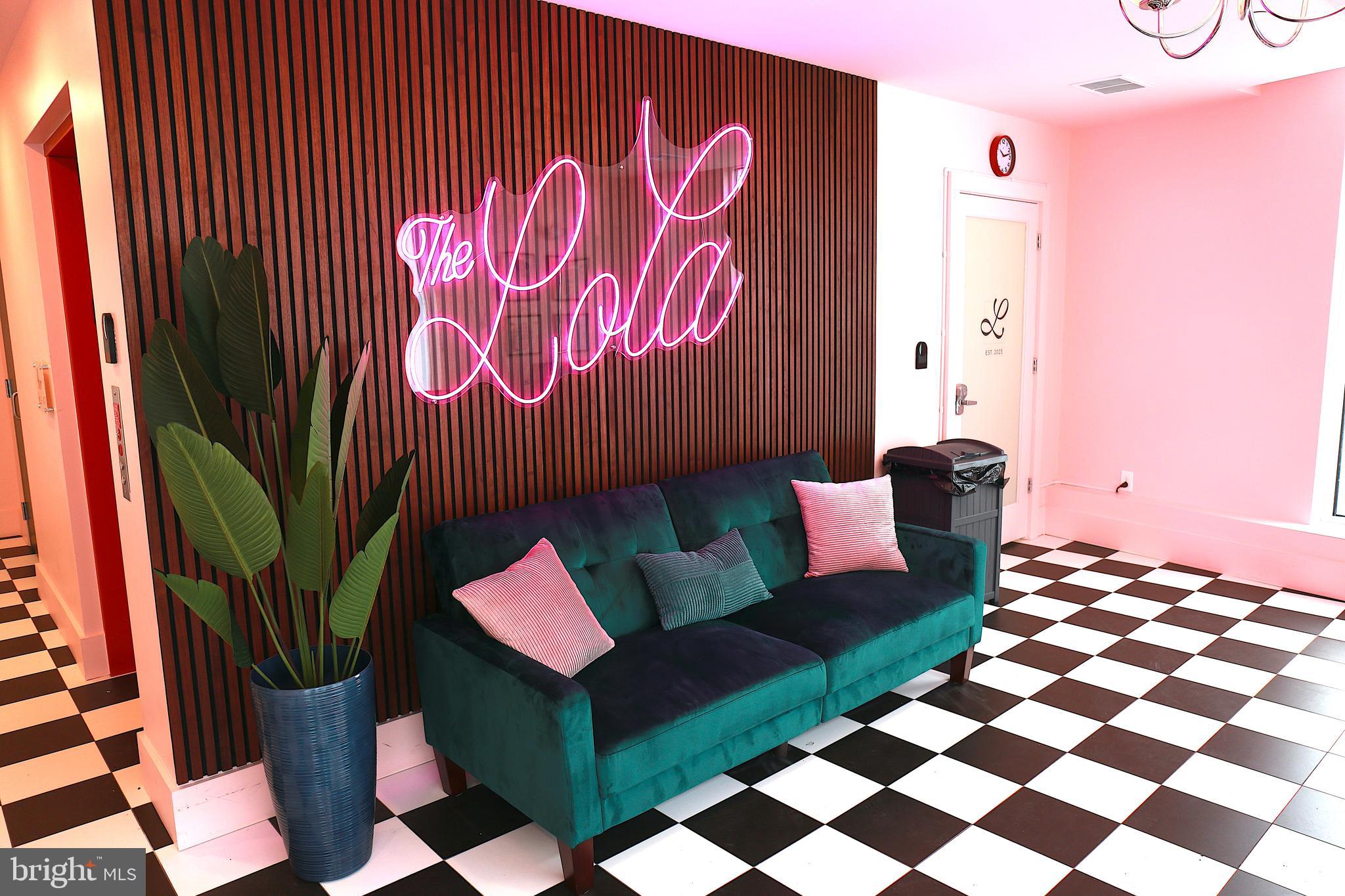 5959-63 Ridge Avenue, Unit 1BED/1BATH Philadelphia, PA 19128 - Photo 30 of 32 a living room with furniture and a rug