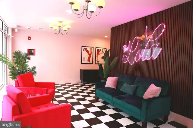 a living room with furniture and a rug