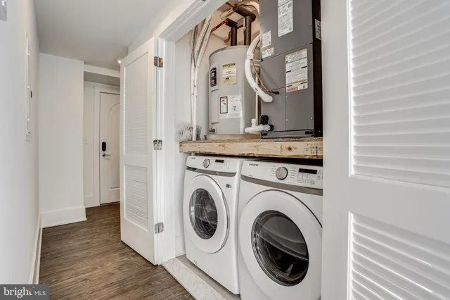 a view of a hallway with washer and dryer
