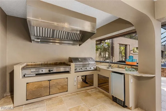 a kitchen with a stove and a sink