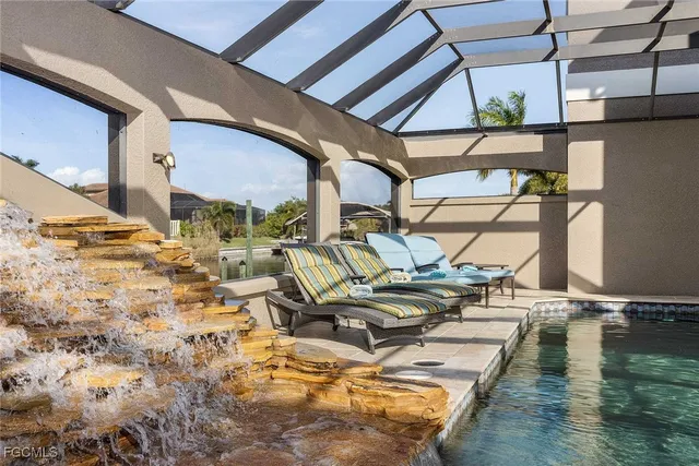a view of a swimming pool with outdoor seating