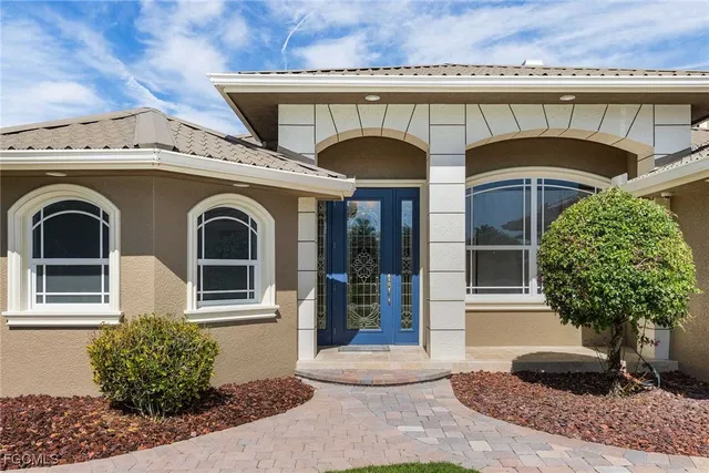 a front view of a house with garden