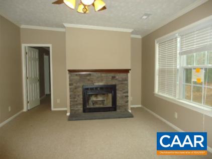 1078 Welsh Run Road Ruckersville, VA 22968 - Photo 7 of 14 a view of an empty room with a fireplace