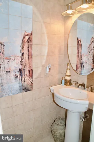 a bedroom with a bed and a table chair