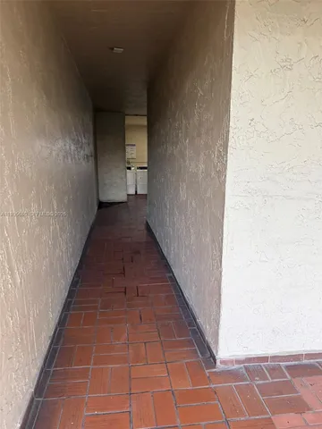 a view of balcony with wooden floor