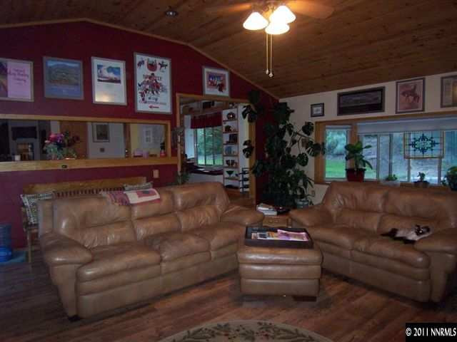 20710 Cooke Drive Reno, NV 89521 - Photo 4 of 13 a living room with furniture and a chandelier