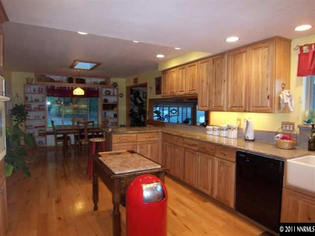 20710 Cooke Drive Reno, NV 89521 - Photo 7 of 13 a kitchen with a sink cabinets and wooden floor