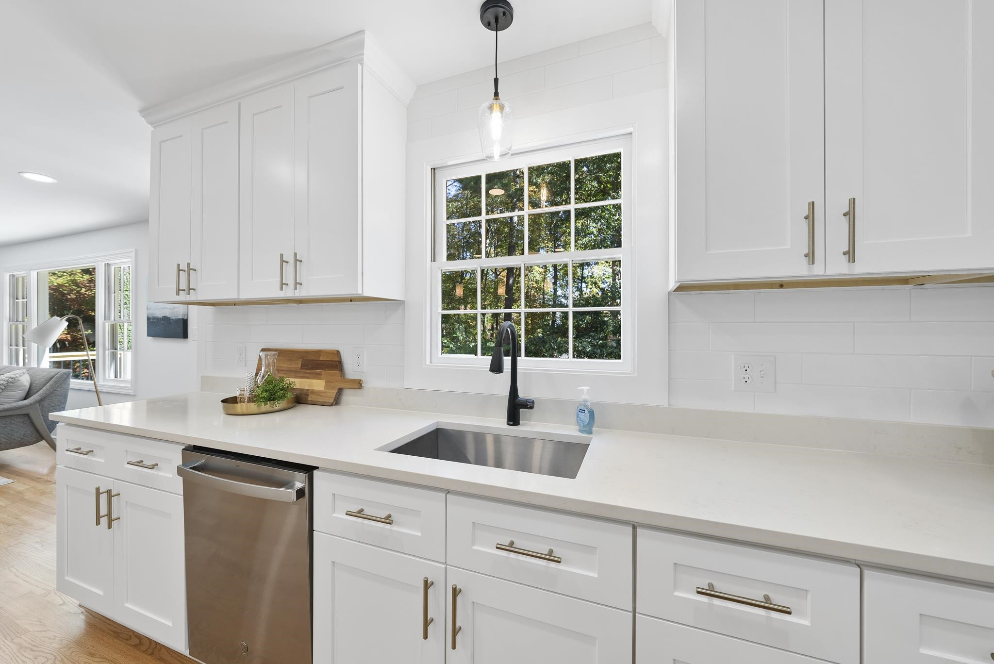 6908 Fernhill Lane Raleigh, NC 27612 - Photo 11 of 24 a kitchen with appliances cabinets and a window
