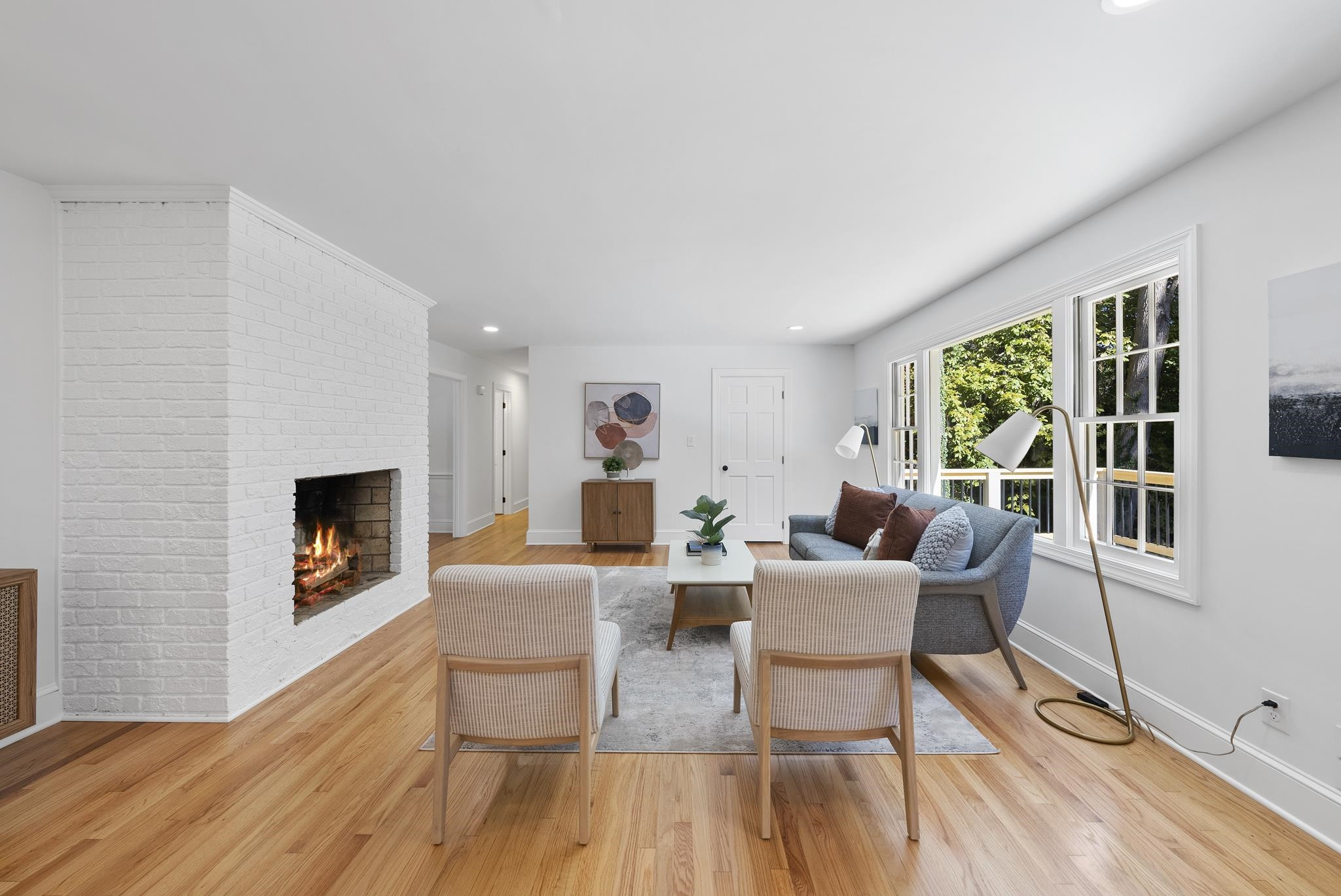 6908 Fernhill Lane Raleigh, NC 27612 - Photo 12 of 24 a living room with fireplace furniture and a wooden floor