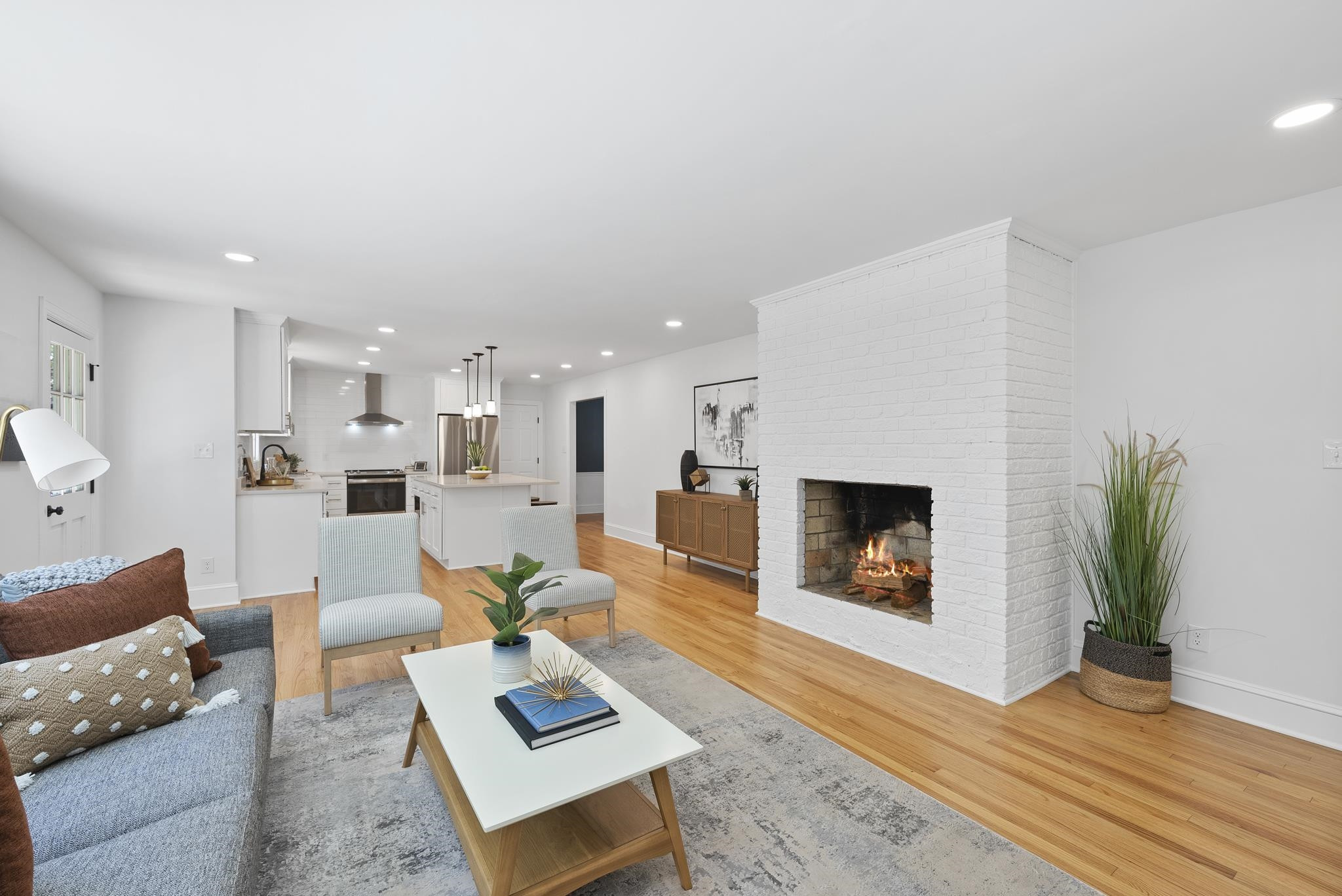 6908 Fernhill Lane Raleigh, NC 27612 - Photo 13 of 24 a living room with furniture and a fireplace