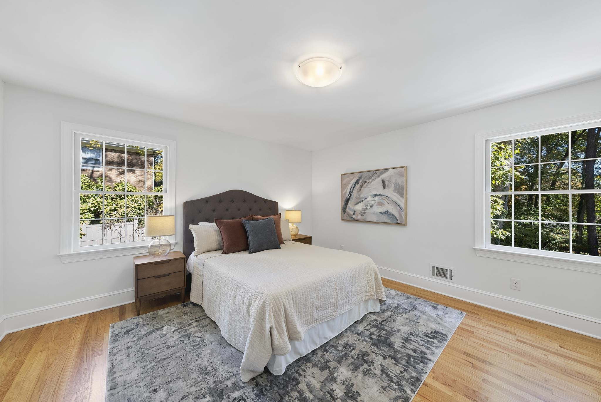 6908 Fernhill Lane Raleigh, NC 27612 - Photo 16 of 24 a bedroom with a bed and a window