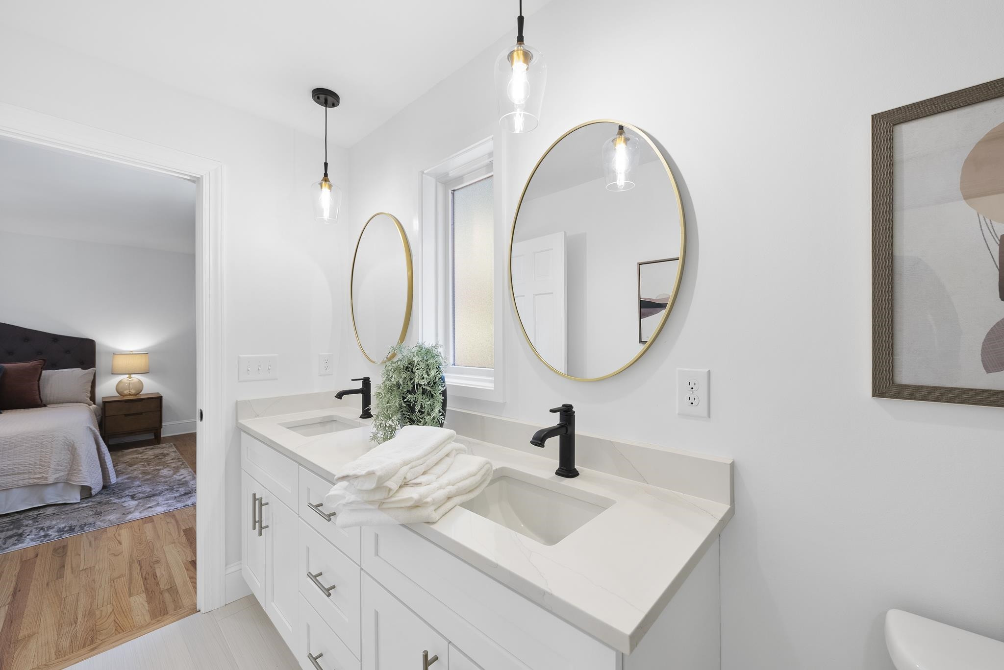 6908 Fernhill Lane Raleigh, NC 27612 - Photo 18 of 24 a bathroom with a double vanity sink and a mirror