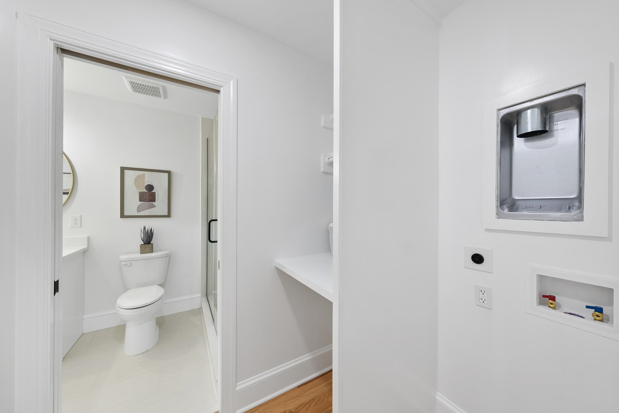 6908 Fernhill Lane Raleigh, NC 27612 - Photo 19 of 24 a bathroom with a toilet sink and mirror