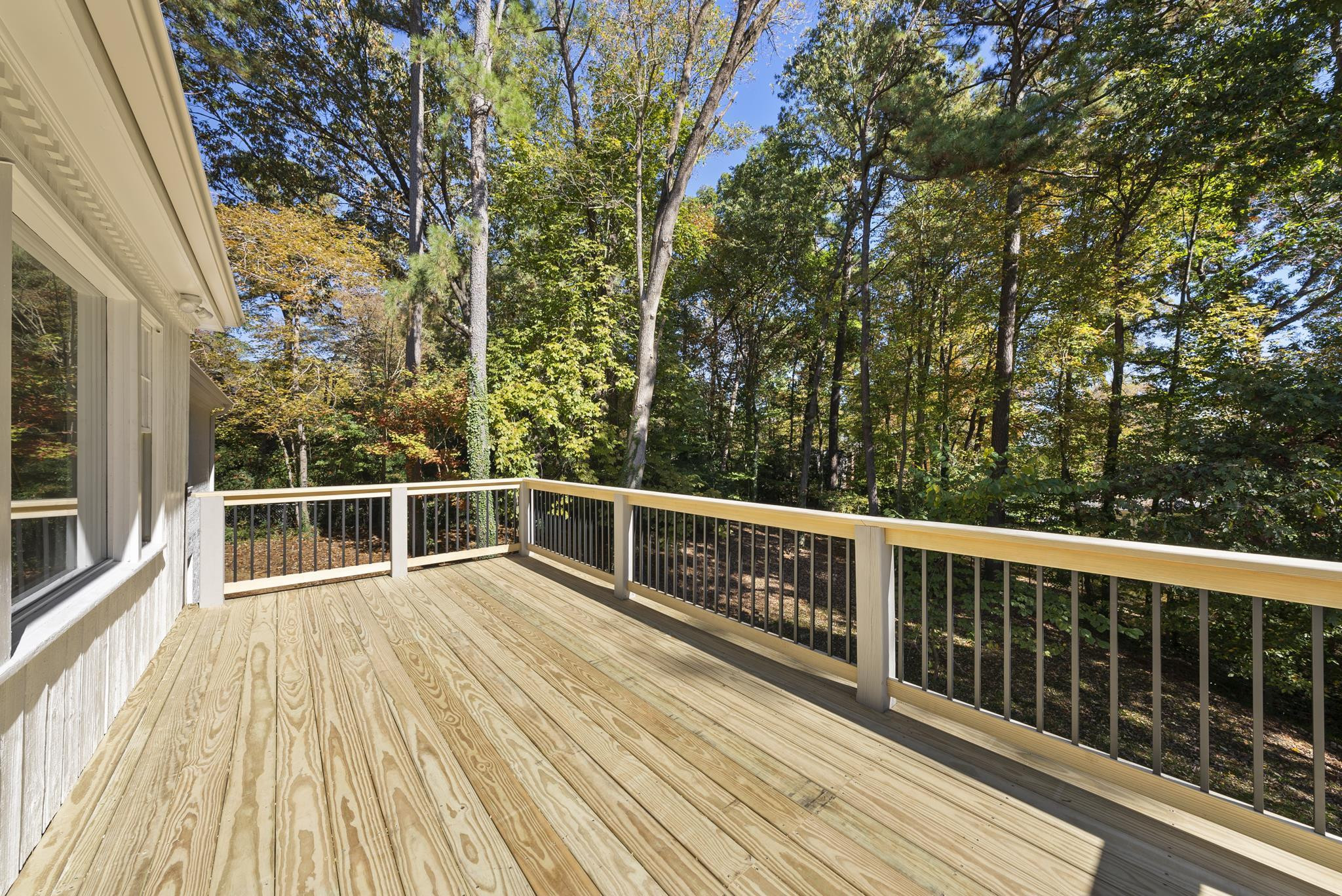 6908 Fernhill Lane Raleigh, NC 27612 - Photo 22 of 24 a view of a balcony with wooden floor