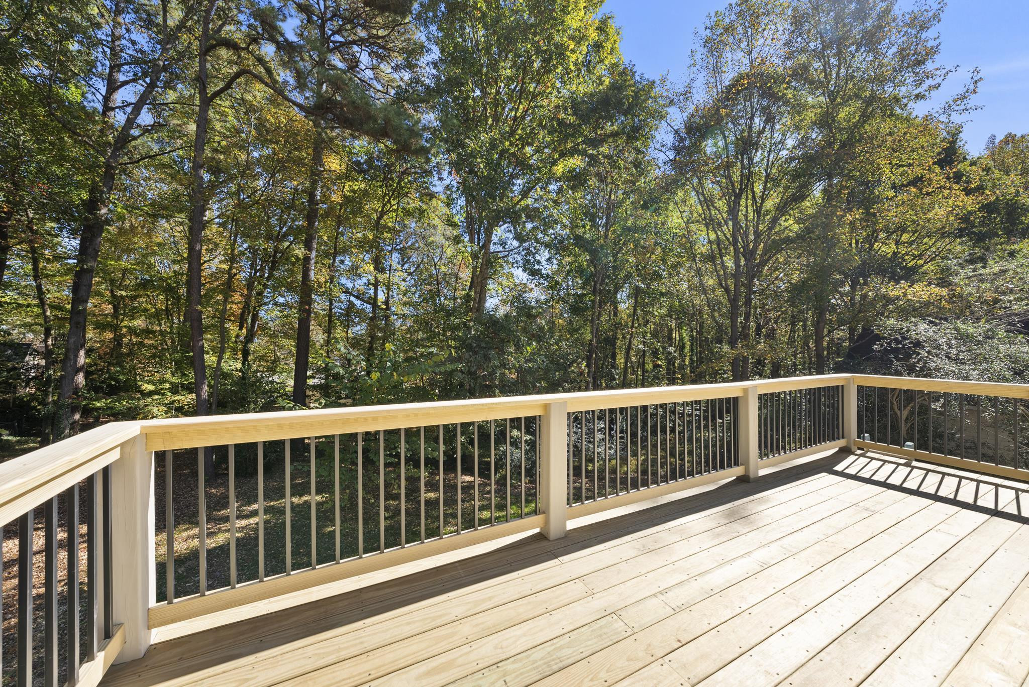 6908 Fernhill Lane Raleigh, NC 27612 - Photo 23 of 24 a view of balcony with wooden floor and fence