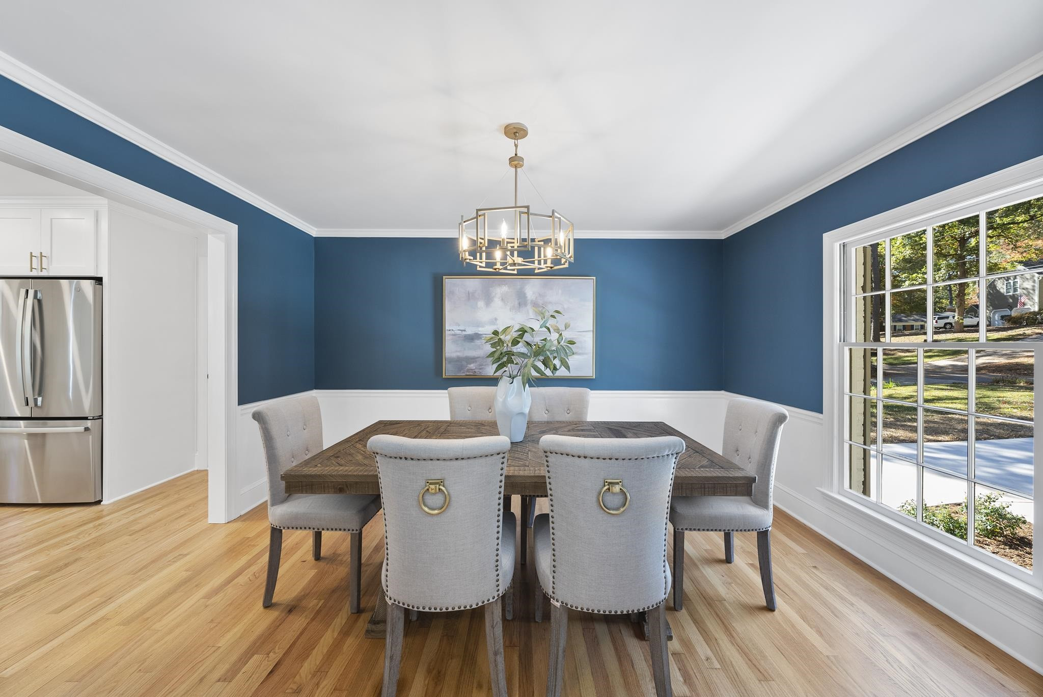 6908 Fernhill Lane Raleigh, NC 27612 - Photo 5 of 24 a view of a dining room with furniture window and wooden floor
