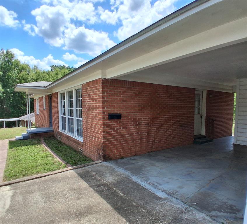 910 Success Street Gilmer, TX 75644 - Photo 18 of 20 a view of a house with a backyard