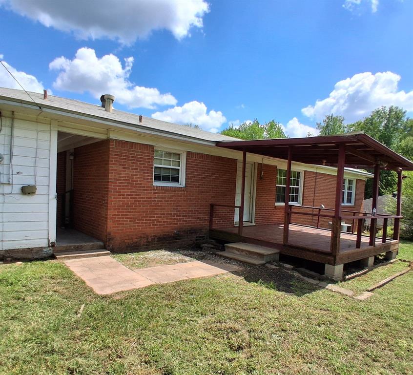 910 Success Street Gilmer, TX 75644 - Photo 19 of 20 a front view of a house with a yard
