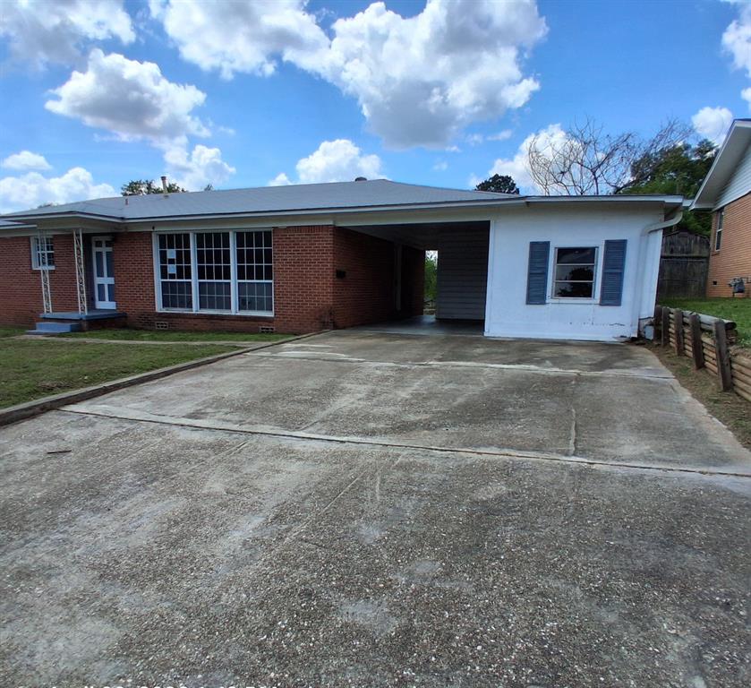 910 Success Street Gilmer, TX 75644 - Photo 2 of 20 a view of a house with a yard and garage
