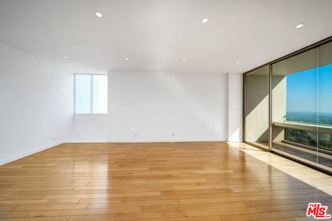 2220 Avenue Of The Stars, Unit 2004W Los Angeles, CA 90067 - Photo 13 of 25 a view of an empty room with a window