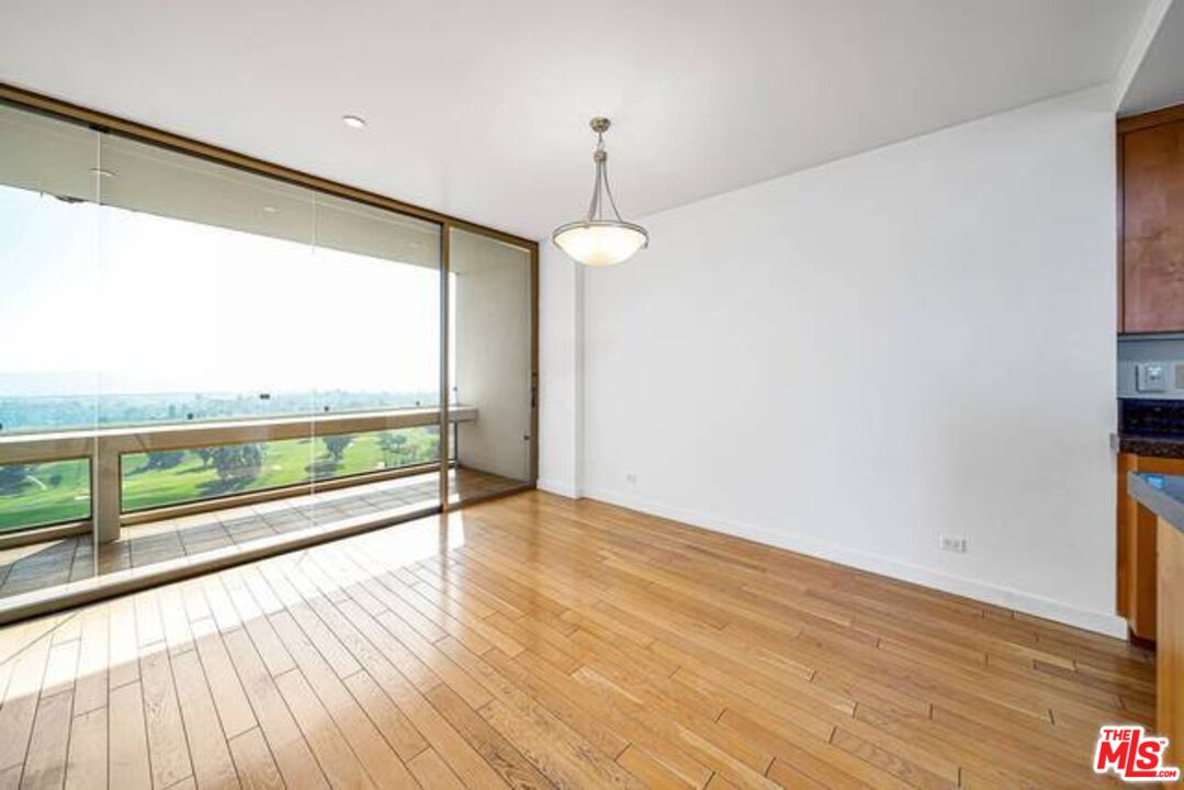 2220 Avenue Of The Stars, Unit 2004W Los Angeles, CA 90067 - Photo 14 of 25 wooden floor in an empty room with a window