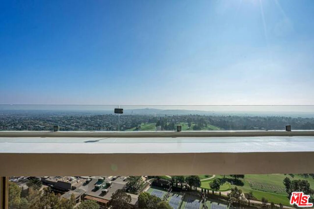 2220 Avenue Of The Stars, Unit 2004W Los Angeles, CA 90067 - Photo 17 of 25 a view of a lake with a car parked