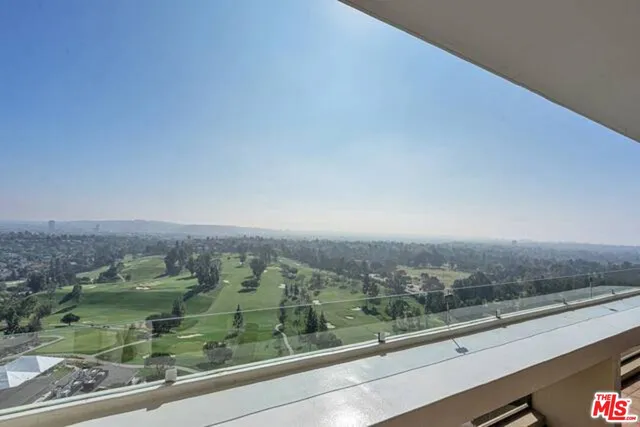 a view of an empty room with a floor to ceiling window
