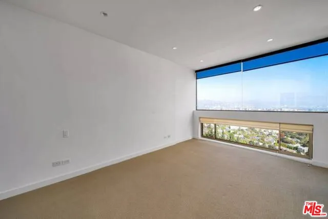 a bathroom with a granite countertop sink and a shower