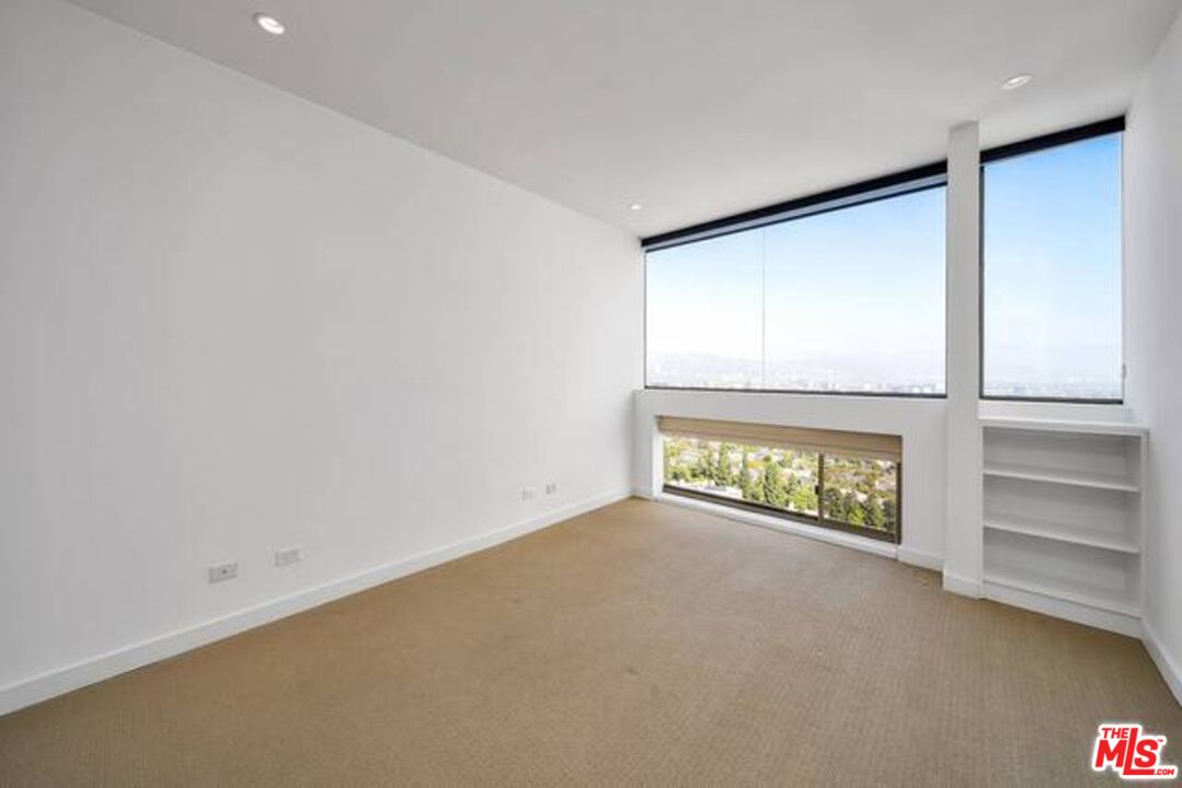 2220 Avenue Of The Stars, Unit 2004W Los Angeles, CA 90067 - Photo 21 of 25 an empty room with a window