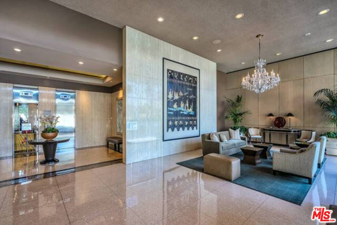 2220 Avenue Of The Stars, Unit 2004W Los Angeles, CA 90067 - Photo 3 of 25 a living room with furniture and a chandelier