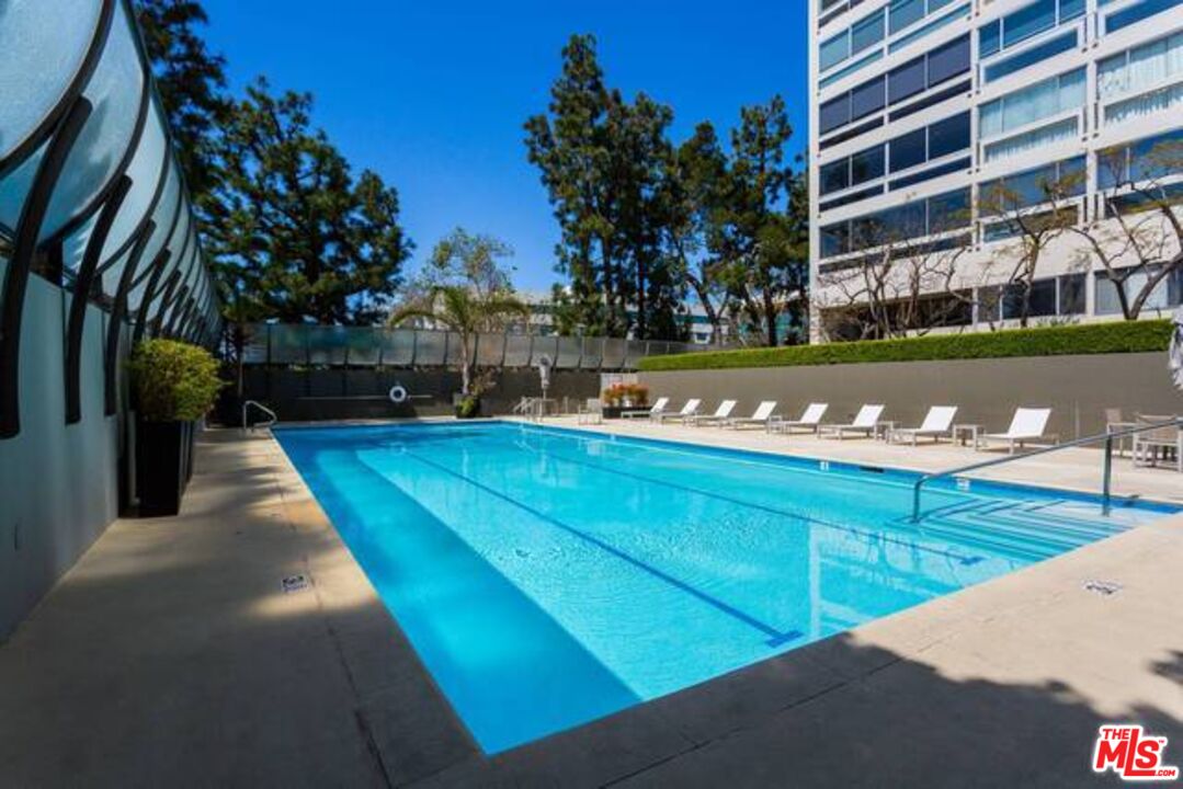 2220 Avenue Of The Stars, Unit 2004W Los Angeles, CA 90067 - Photo 5 of 25 a view of a swimming pool with a bench