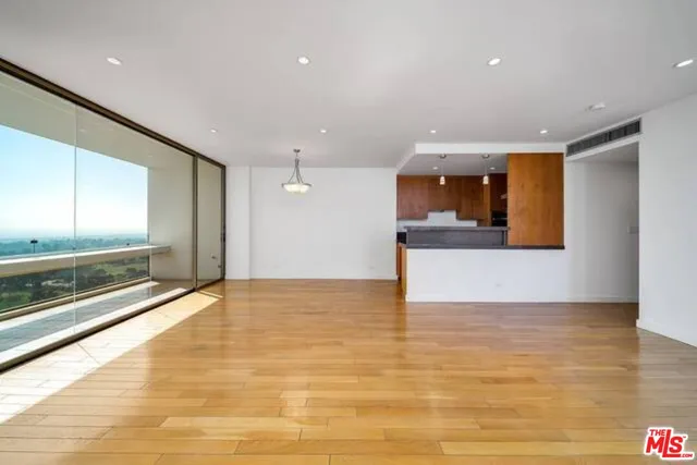 a view of kitchen with cabinets and wooden floor
