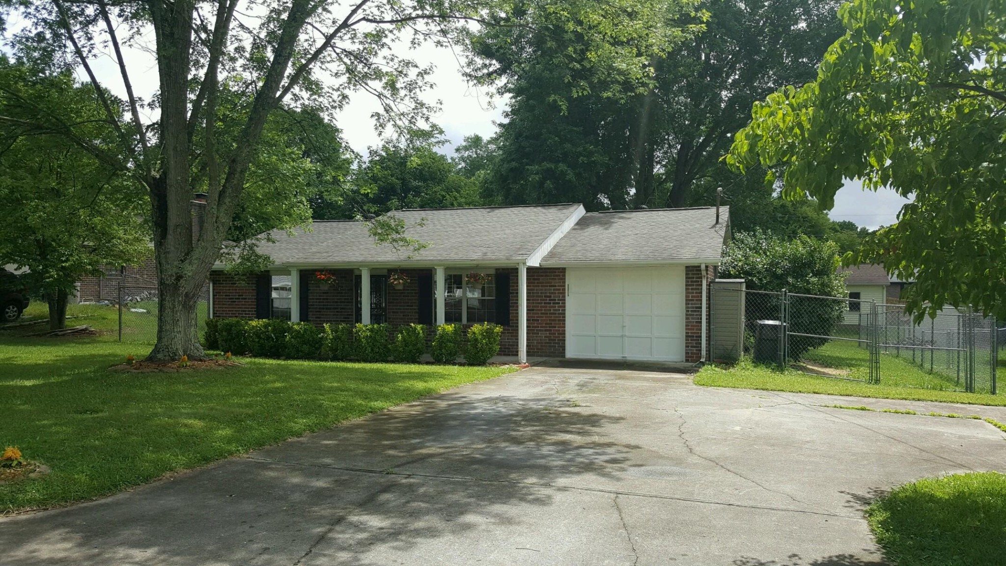 1916 Cecil Johnson Road Knoxville, TN 37921 - Photo 1 of 8 a front view of house with yard and green space