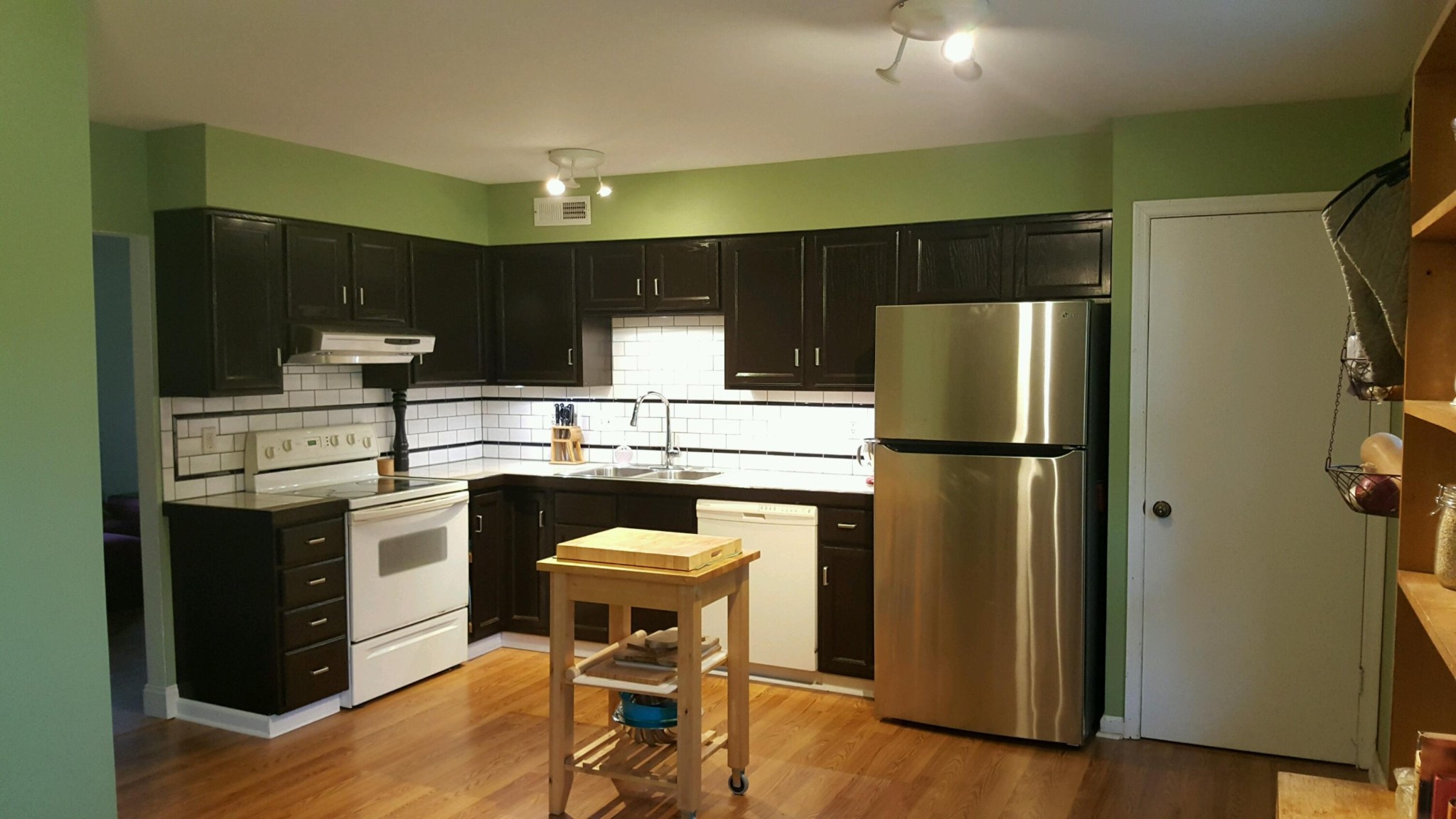 1916 Cecil Johnson Road Knoxville, TN 37921 - Photo 3 of 8 a kitchen with a refrigerator and table chairs